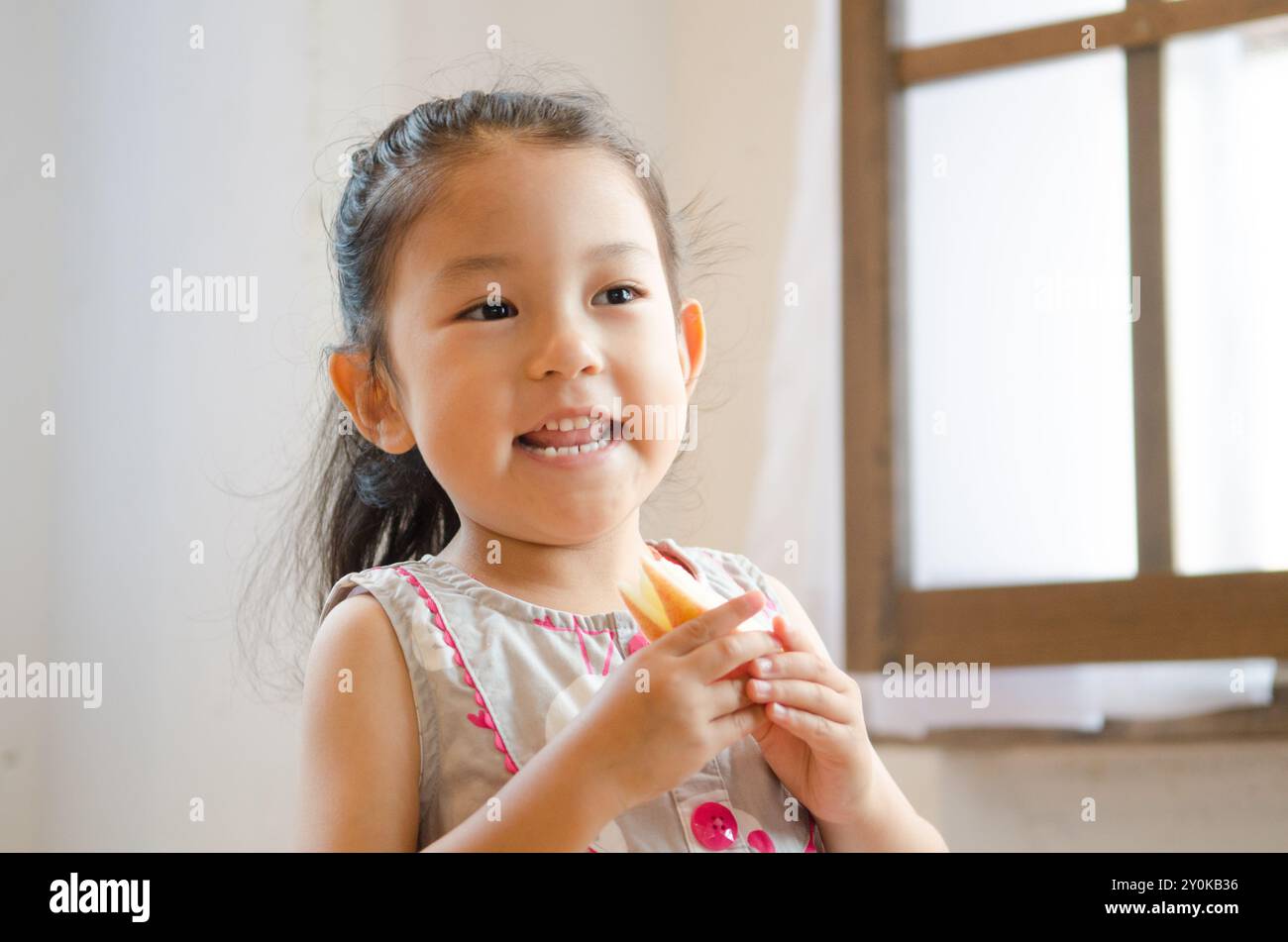 Girl with?apple cut in the form of rabbit Stock Photo - Alamy
