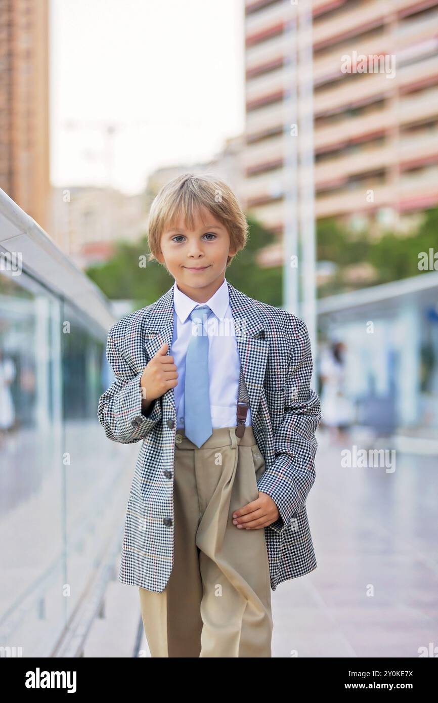 Beautiful fashion little boy child in suit and tie visiting Monaco for fashion days enjoying summer in Monaco Monte Carlo Stock Photo Alamy