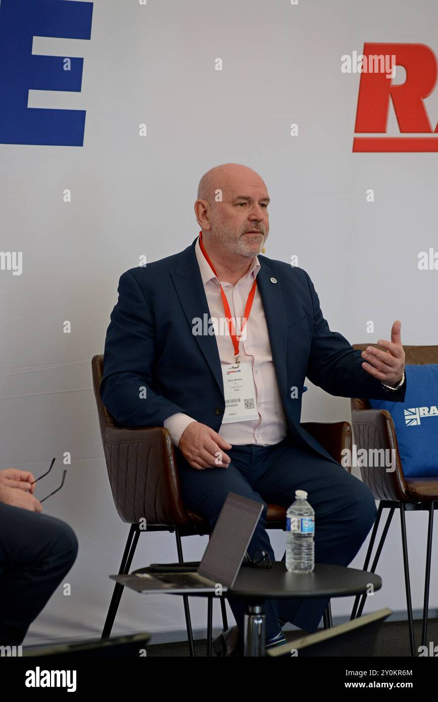 Mick Whelan, General Secretary ASLEF speaking with RAIL magazine editor Dickon Ross at Rail Live industry show, Long Marston, June 2024 Stock Photo