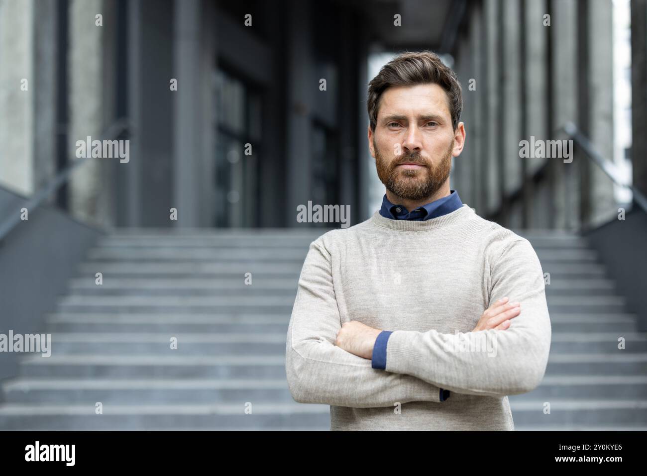 Strong man stands arms hi-res stock photography and images - Alamy
