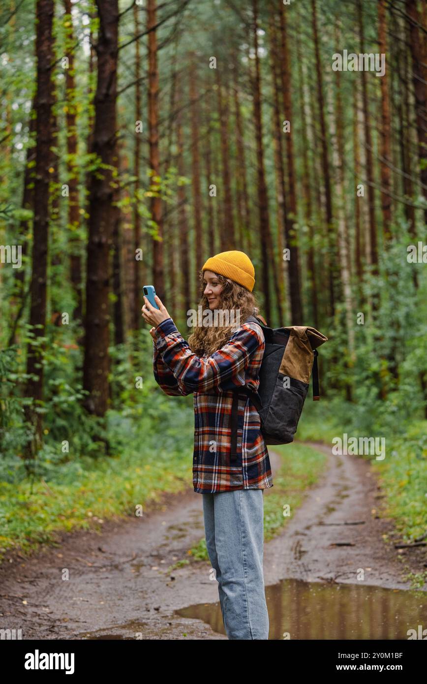 Curly woman takes photos on hi-res stock photography and images - Alamy