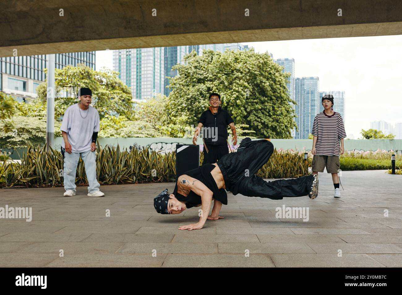 Breakdancing Performance by Urban Dancers in Park Stock Photo