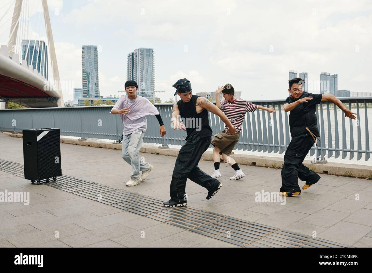 Dancing Group Performing Hip-Hop Routine Outdoors Stock Photo