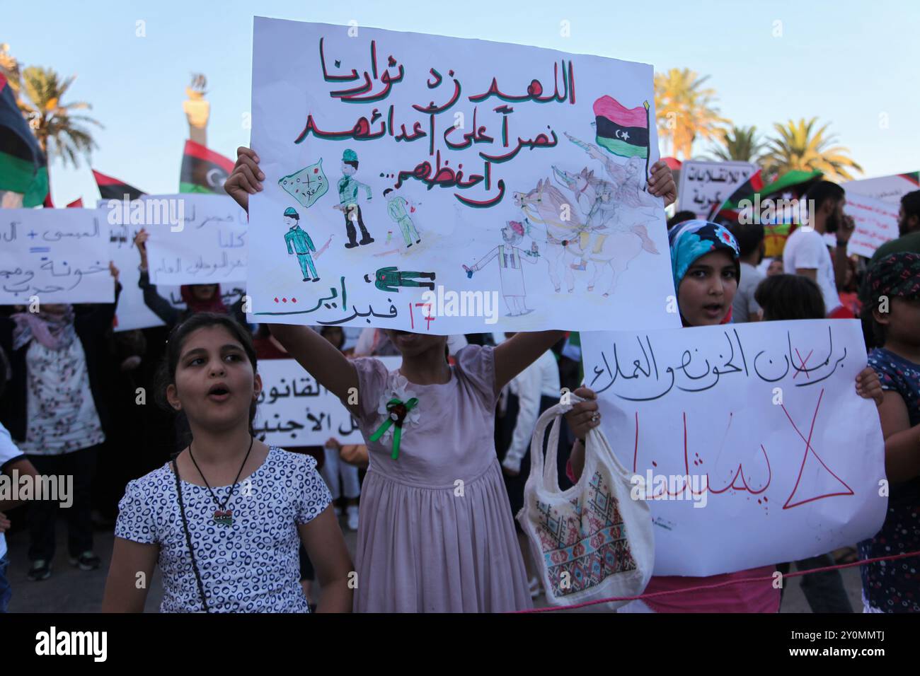 People demonstrate against the pro-colonel Haftar's brigades, in Tripoli, Libya. In 2014 the Fajar Libya group seized Tripoli and the Tripoli airport from General Haftar's forces. The Fajar Libya is one of the rebels factions that participated in the fighting to overthrow Colonel Muammar Gaddafi in 2011 Stock Photo