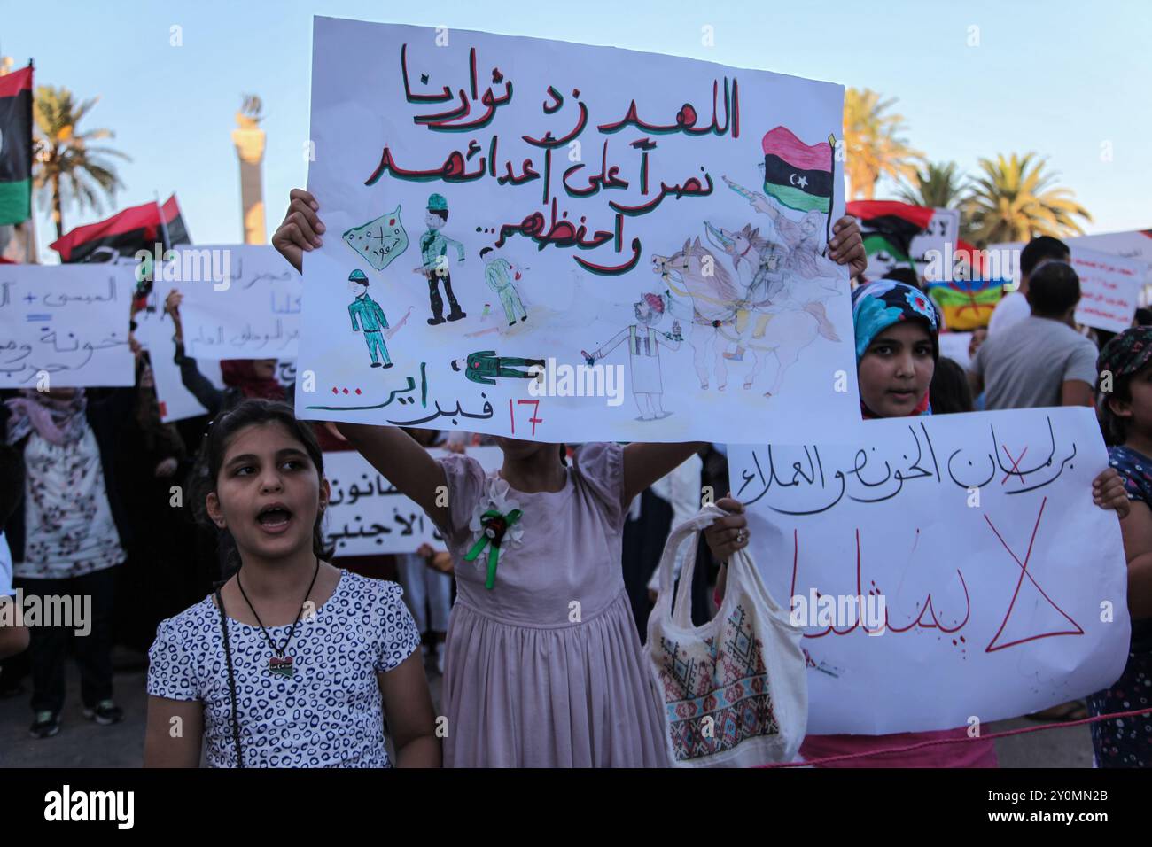 People demonstrate against the pro-colonel Haftar's brigades, in Tripoli, Libya. In 2014 the Fajar Libya group seized Tripoli and the Tripoli airport from General Haftar's forces. The Fajar Libya is one of the rebels factions that participated in the fighting to overthrow Colonel Muammar Gaddafi in 2011 Stock Photo