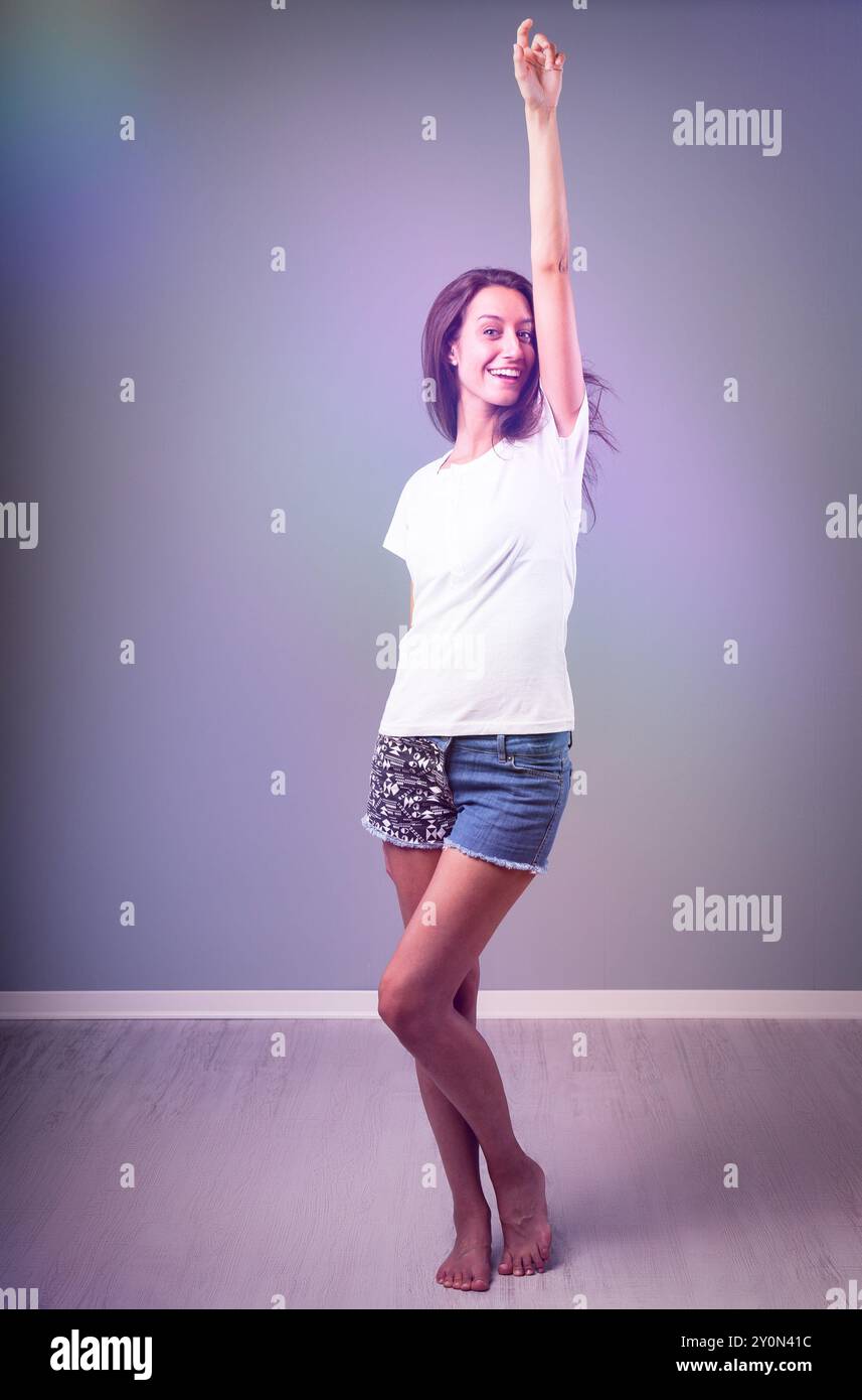 Carefree young woman dances barefoot hi-res stock photography and ...