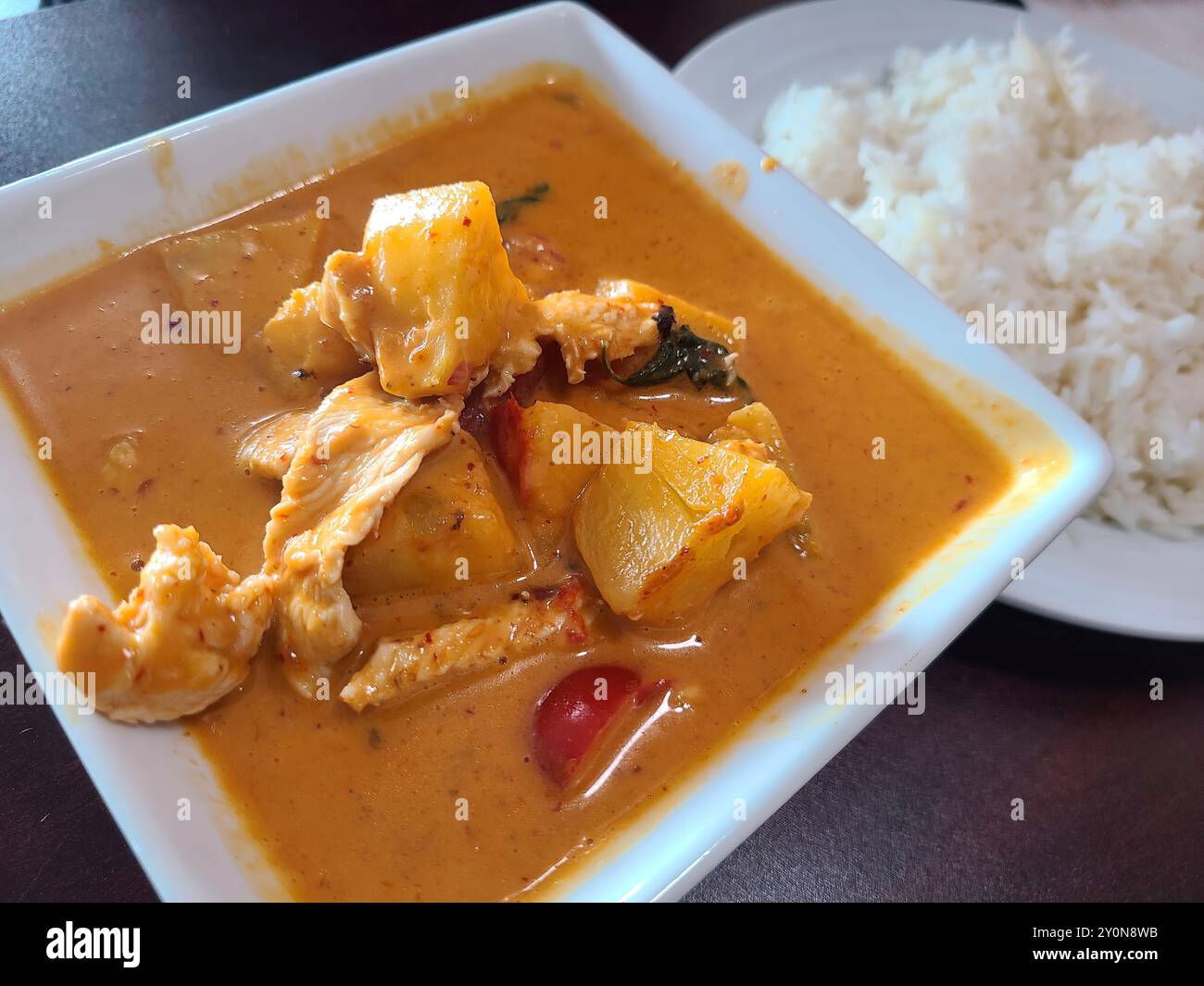 Thai Pineapple Chicken Curry with Rice Eye-Level View Stock Photo