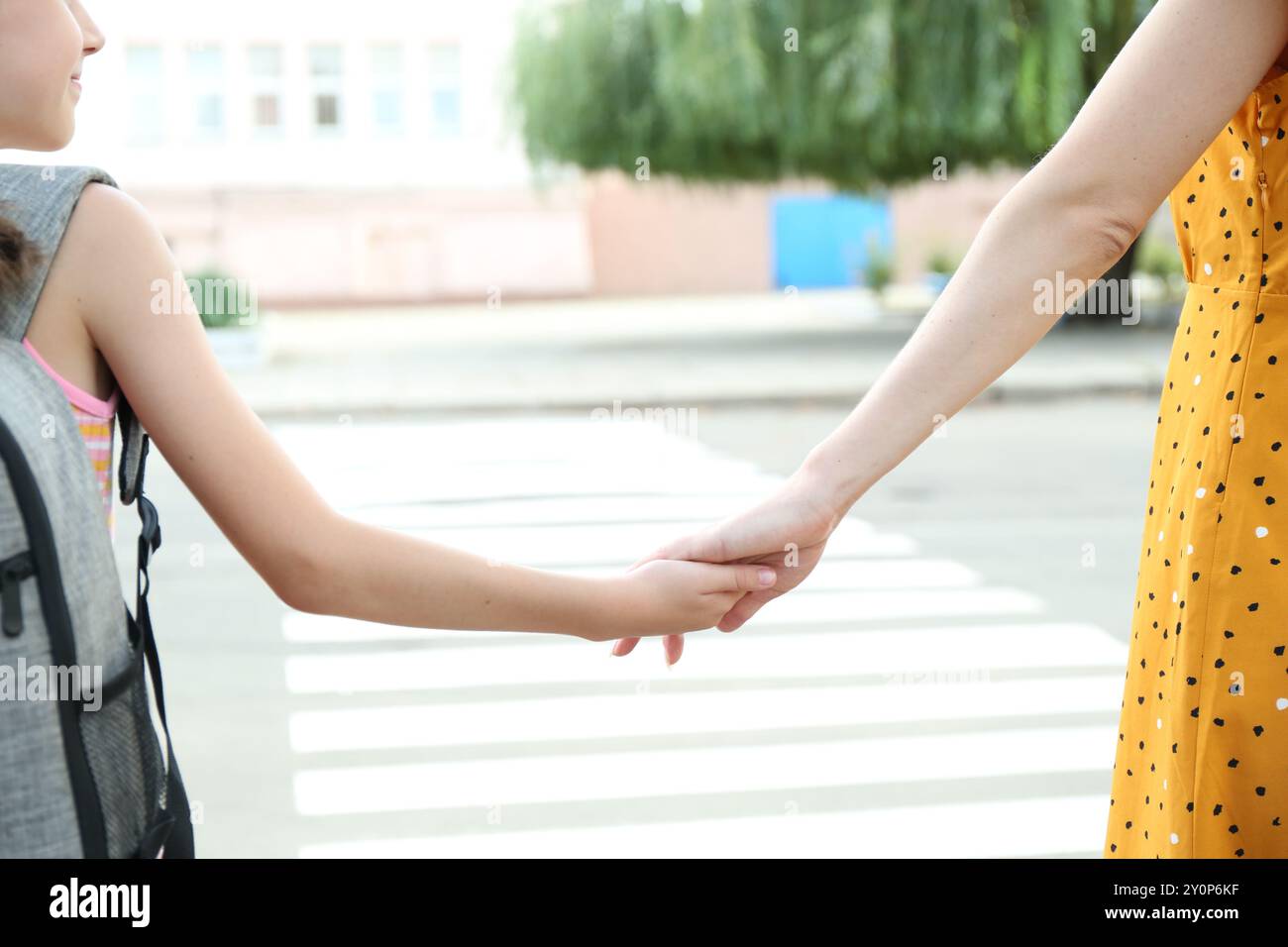 Mother and daughter holding hands outdoors, closeup Stock Photo - Alamy