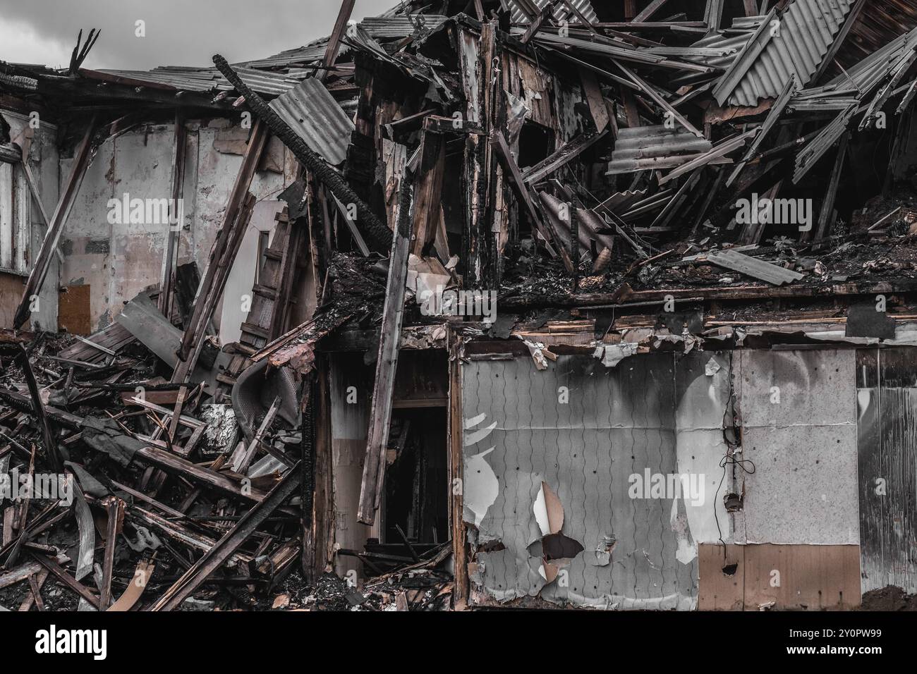Destroyed and burnt out building after being hit by shell. War and ...