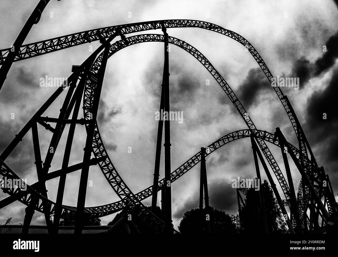 A roller coaster against a cloudy sky Stock Photo