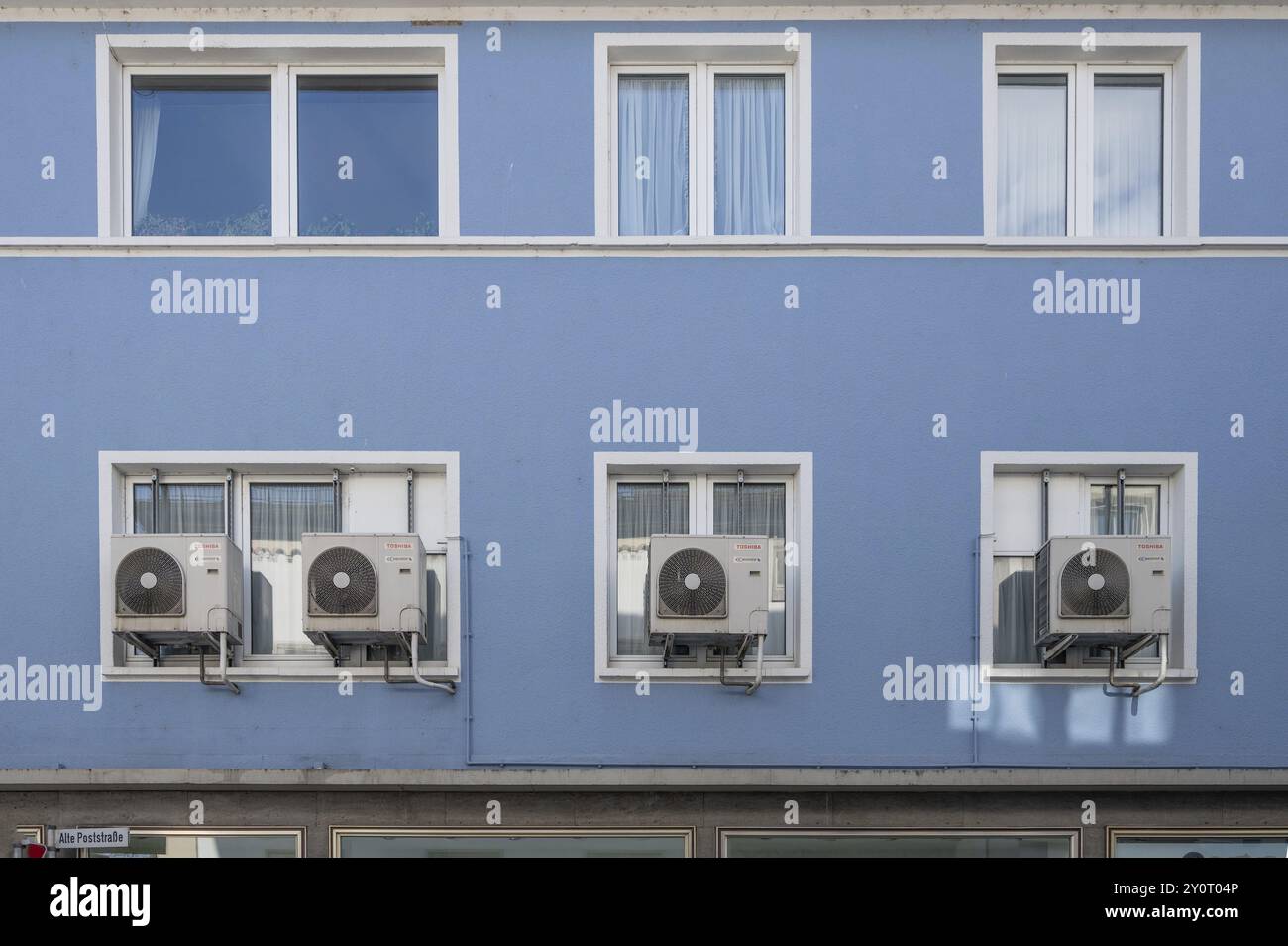 Air conditioning units outside the window of an apartment block ...