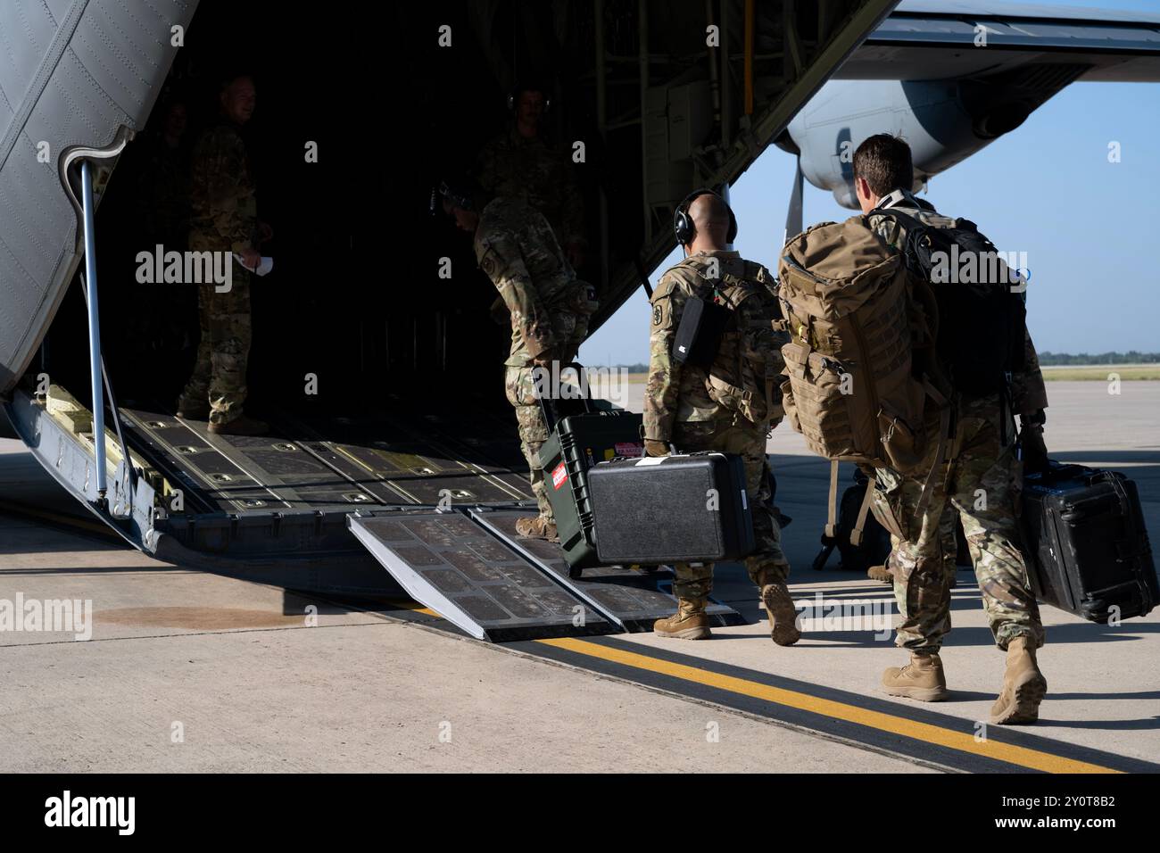 U.S. Airmen and Soldiers board a Texas Air National Guard C-130J Super Hercules on the flightline during a Vapor Trails medical training exercise at Joint Base San Antonio-Kelly Field Annex, Texas, Aug. 22, 2024.  Medical professionals assigned to the Air Force, ANG and Army honed their skills treating and transporting simulated patients. Their knowledge was tested and enhanced through a series of evaluated scenarios. (U.S. Air Force photo by Kathryn R.C. Reaves) Stock Photo