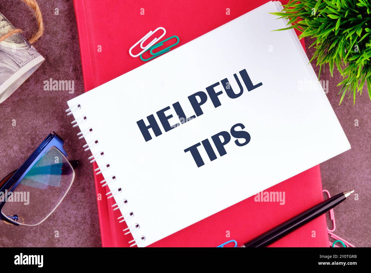 Helpful Tips words there is a note in the notebook for actions Stock Photo