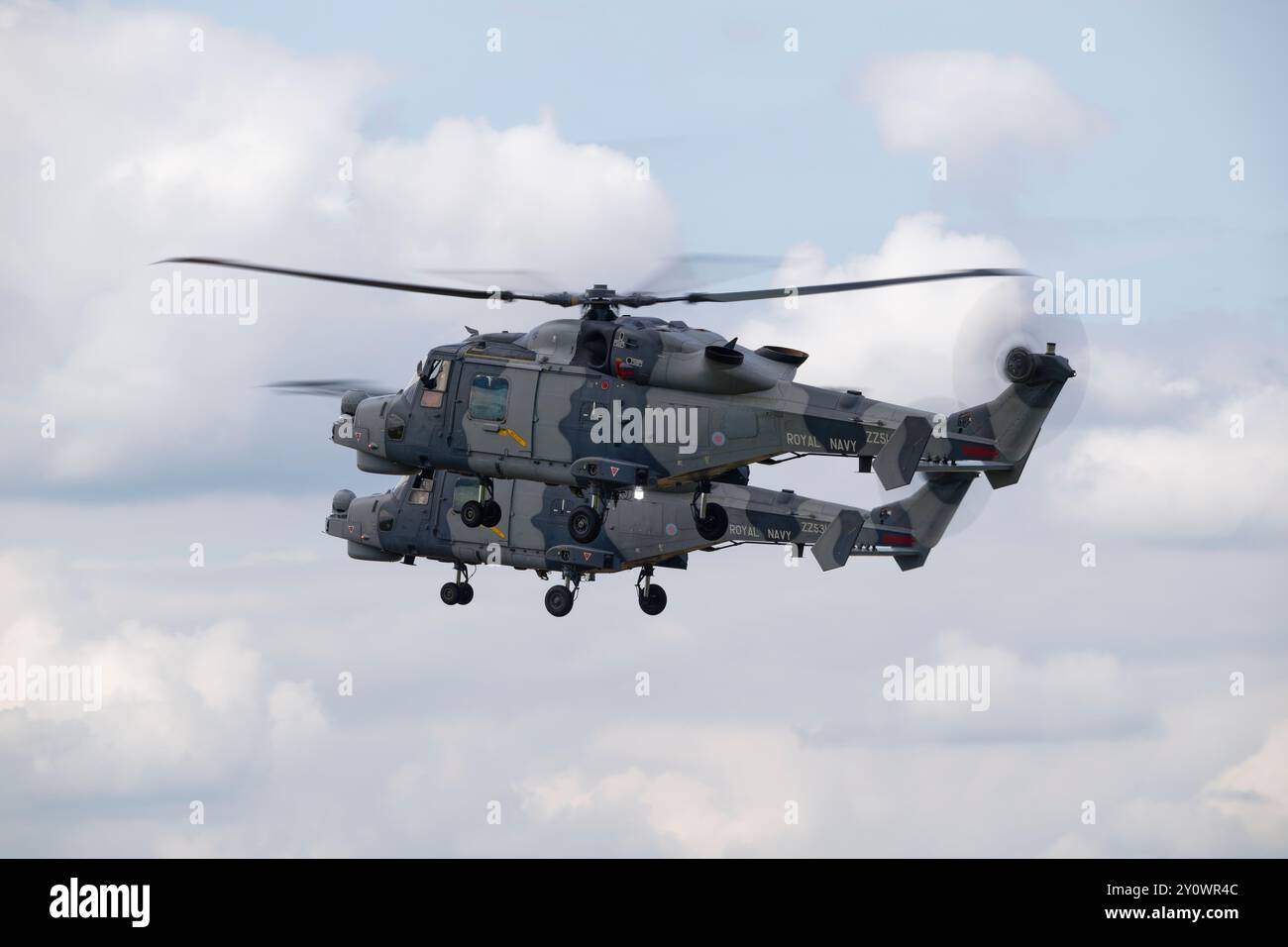 Two Leonardo Wildcat HMA2 helicopters from 825 Naval Air Squadron Yeoviltion, forming the Black Cats helicopter display team arrive at RAF Fairford Stock Photo