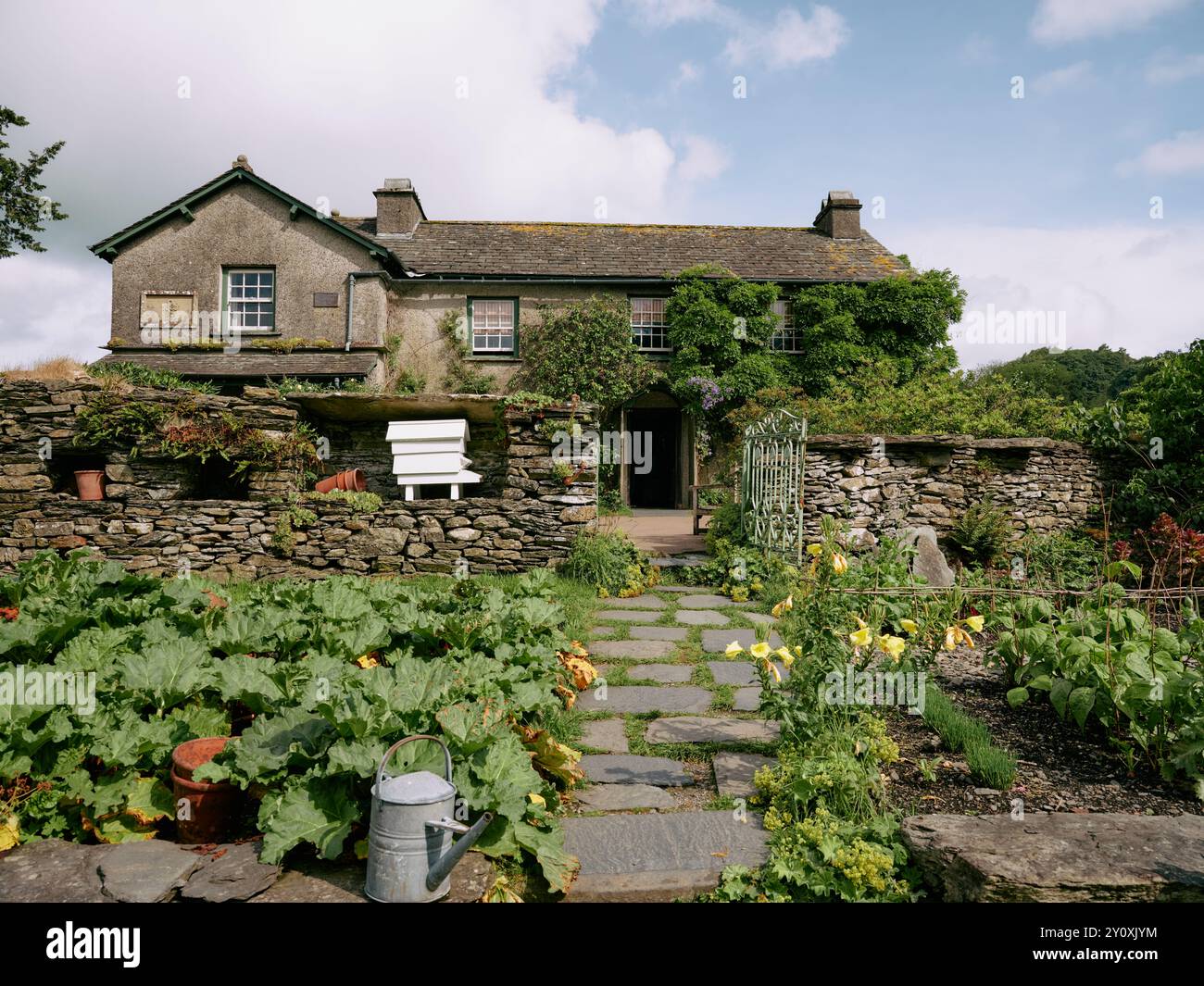 Beatrix Potter's farmhouse retreat Hill Top and garden in Near Sawrey in the Lake District Cumbria England UK Stock Photo