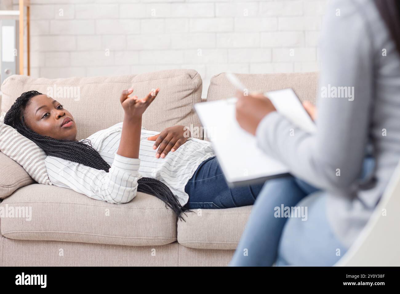 Desperate black woman lying hi-res stock photography and images - Alamy