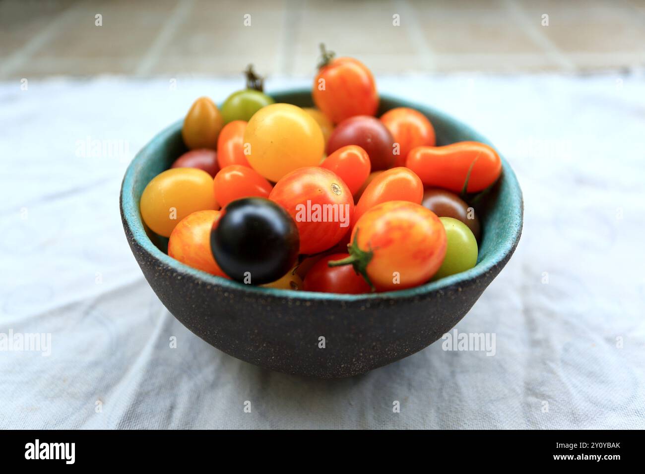 Cherries in dish on the table Stock Photo