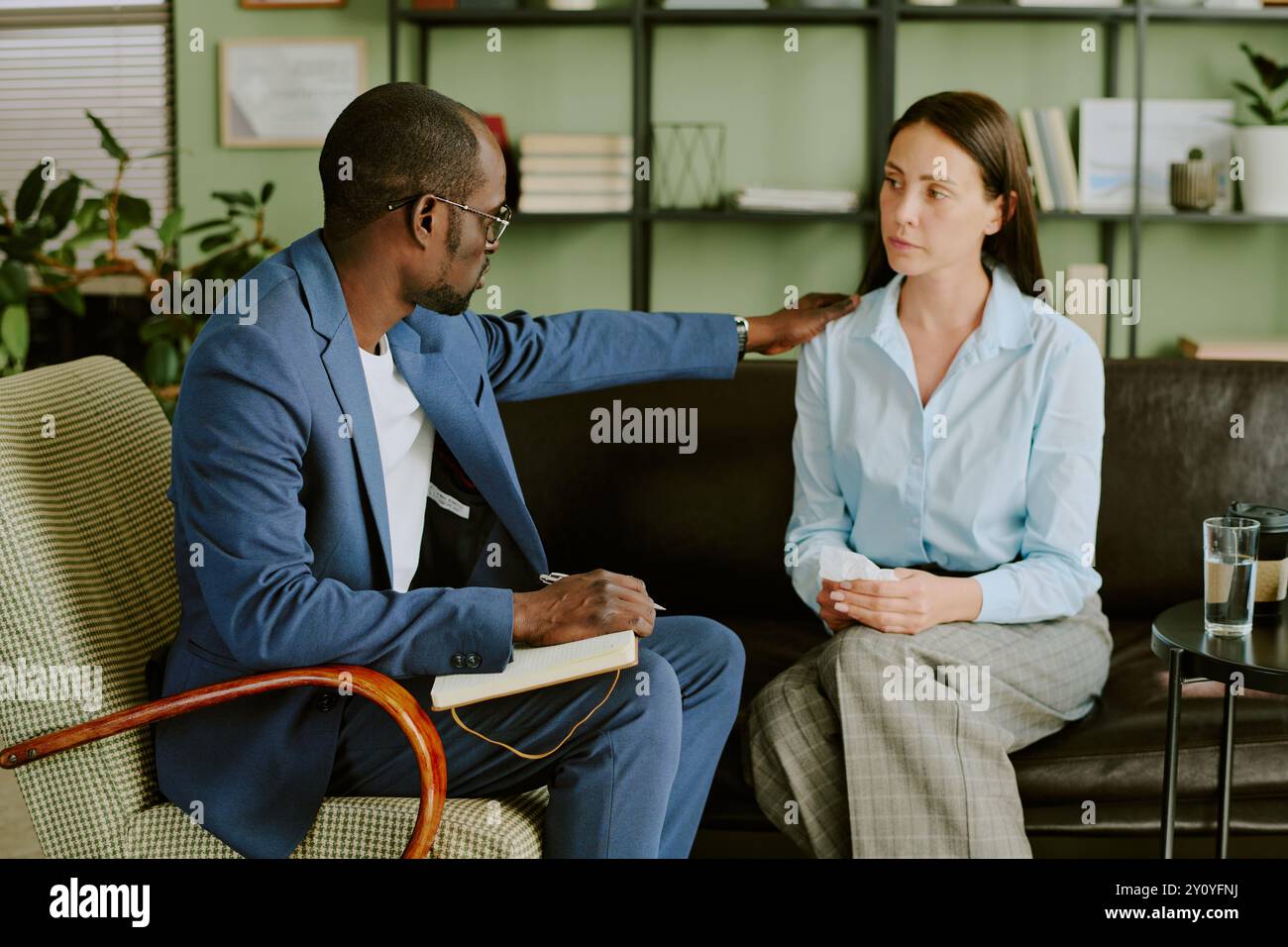 Discussing Project Details in Modern Office Setting Stock Photo