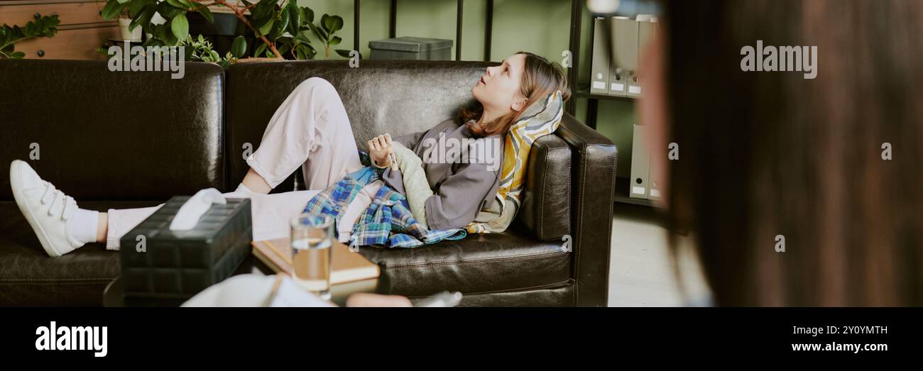 Woman on sofa in living hi-res stock photography and images - Alamy