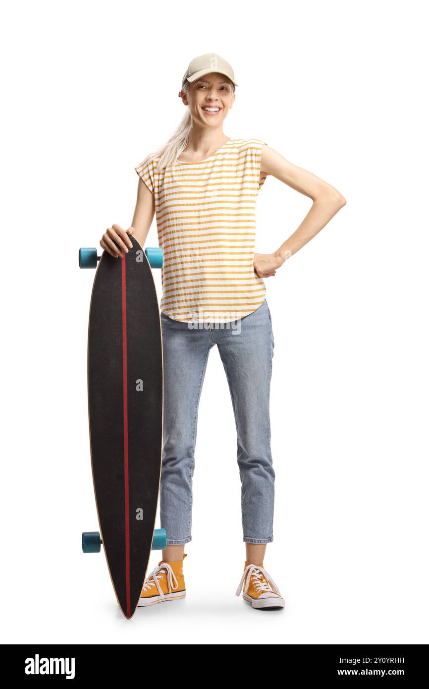Young female posing with a longboard isolated on white background Stock Photo