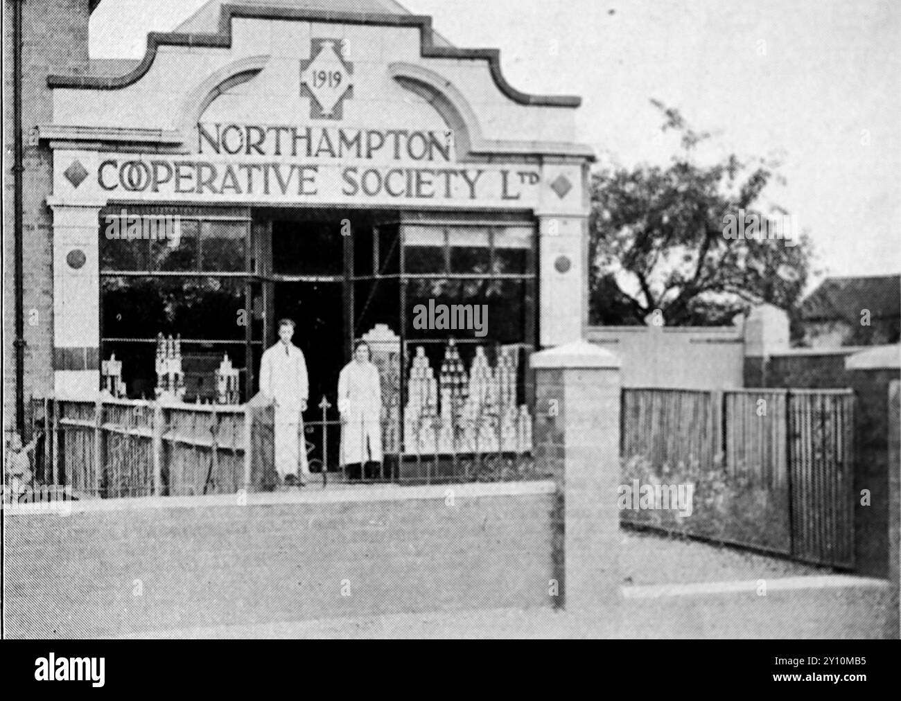 Shopfront of the No. 15 grocery branch of the Northampton Co-op at Roade, Northampton. From a series of photographs celebrating the jubilee of the Northampton Co-Operative Society Ltd, (1870-1920). The Co-operative Society was a British consumer co-operative and is known as the Co-operative Group Ltd. today. In the nineteenth and twentieth centuries the co-operatives were operated on a regional basis. Stock Photo