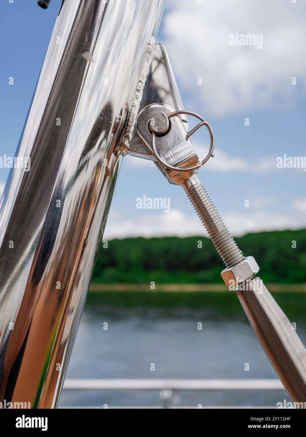 Fastening, securing a shade on the sun deck made of chrome, support ...