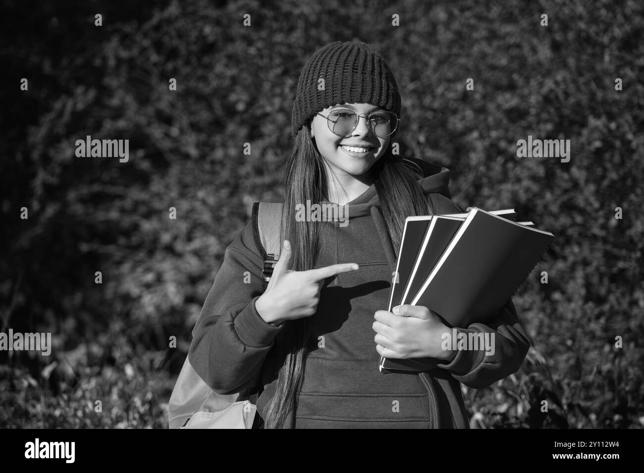 back to school. autumn girl holding school homework. knowledge for adolescence. teen girl in autumn park outdoor. autumn is a time to study. knowledge Stock Photo