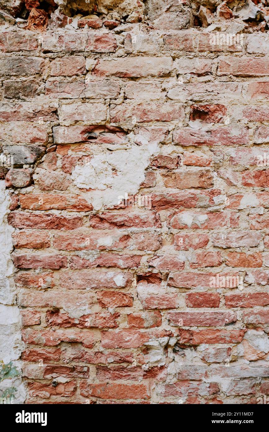Weathered Brick Wall with Cracked and Peeling Plaster Stock Photo - Alamy