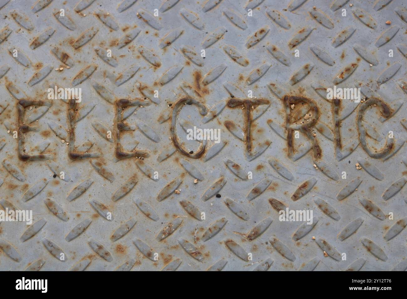 electric metal plate covering on ground Stock Photo