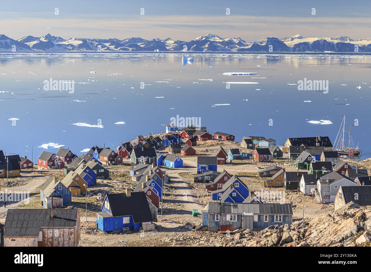 Inuit Settlement At Fjord In Front Of Mountains Icebergs Sunny Scoresby Inuit Settlement At Fjord In Front Of Mountains Icebergs Sunny Scoresby Sund East Greenland Greenland North America 2Y130KA