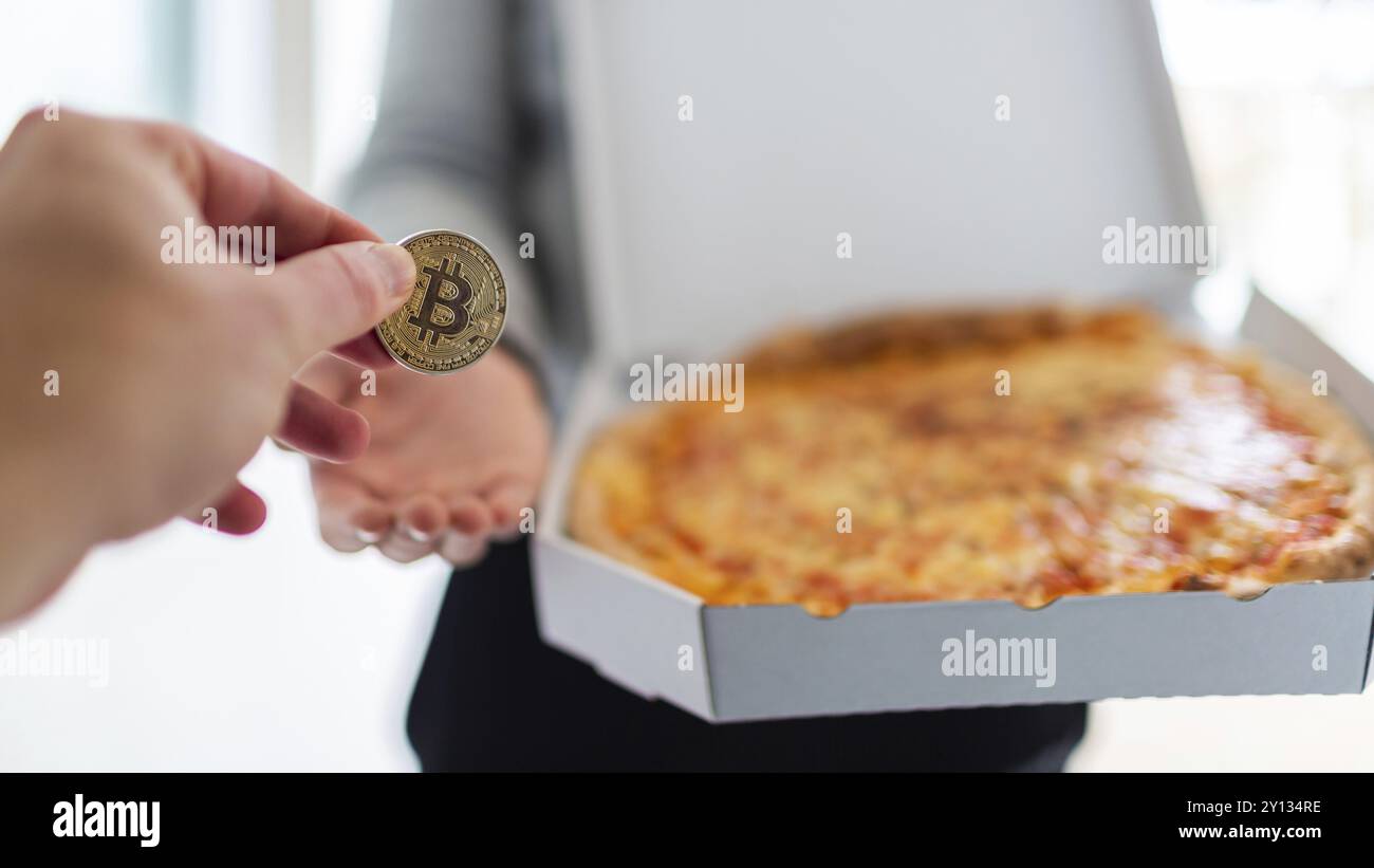Bitcoin pizza day anniversary. The first reported exchange of cryptocurrency  for a consumer product on May 22, 2010 Stock Photo - Alamy