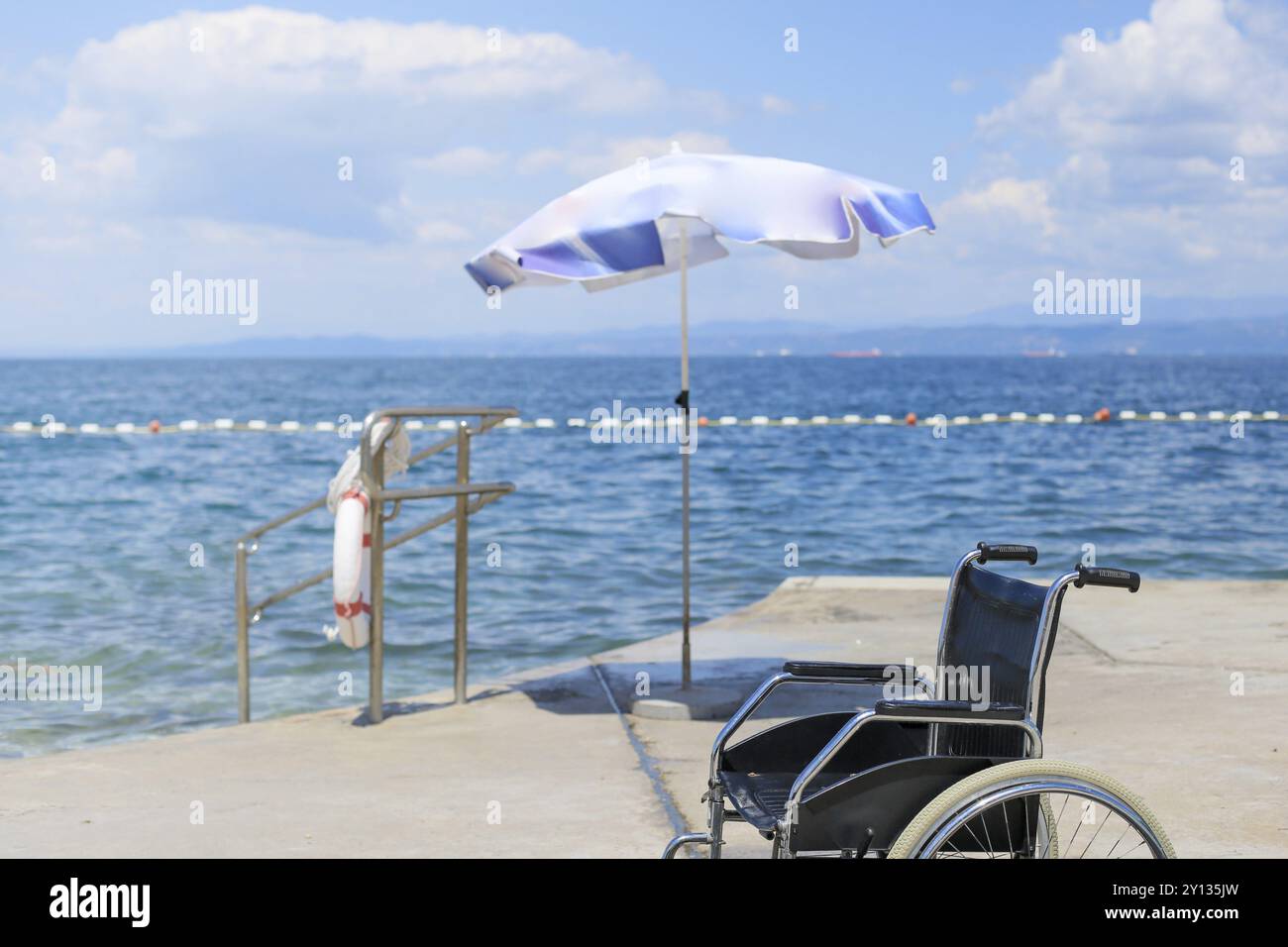 Image showcasing Wheelchair on an accessible beach for transportation of people with ...