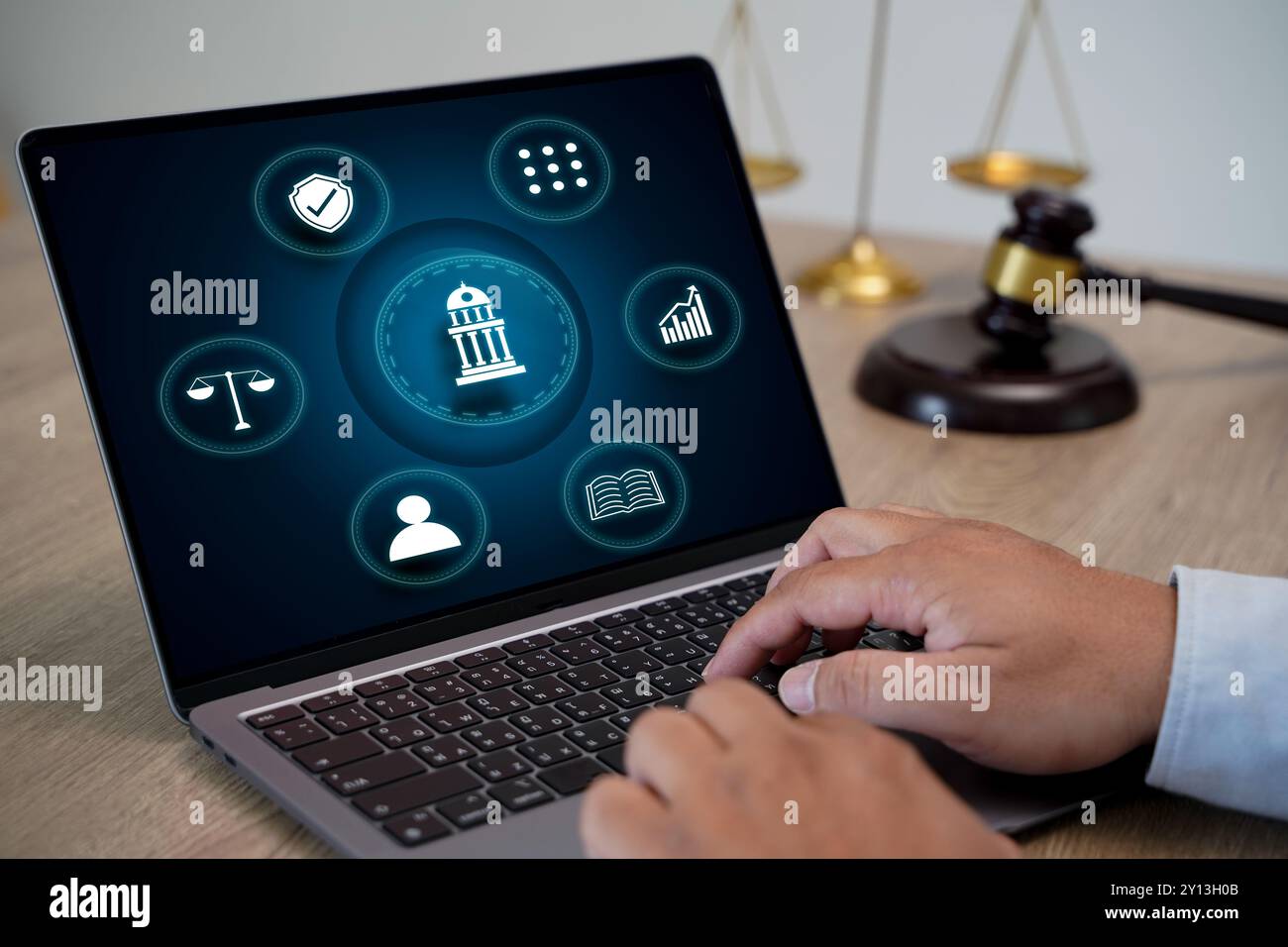 laptop computer with legal law scale Male judge working on laptop ...