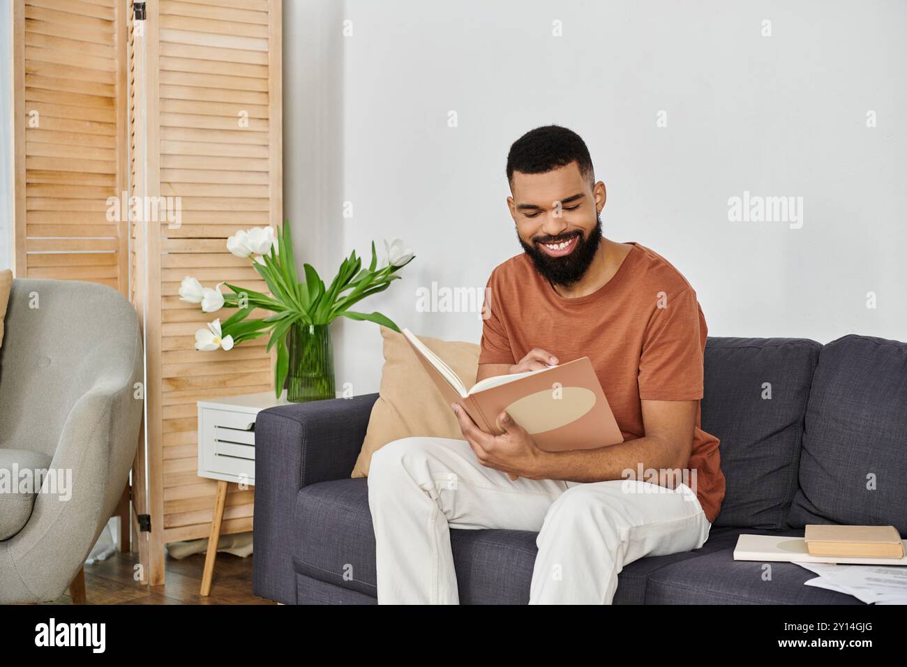 Man seated comfortably table hi-res stock photography and images - Alamy
