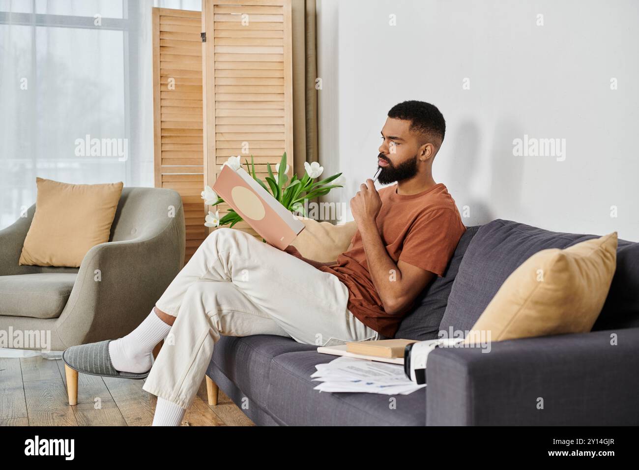 Man seated comfortably wooden table hi-res stock photography and images ...
