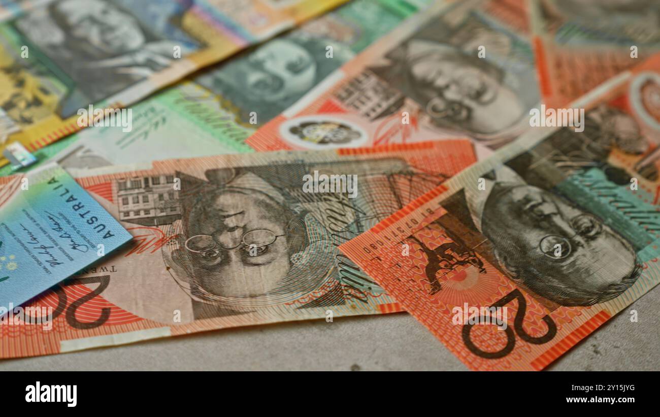 Australian banknotes scattered on a flat surface, showcasing vibrant ...