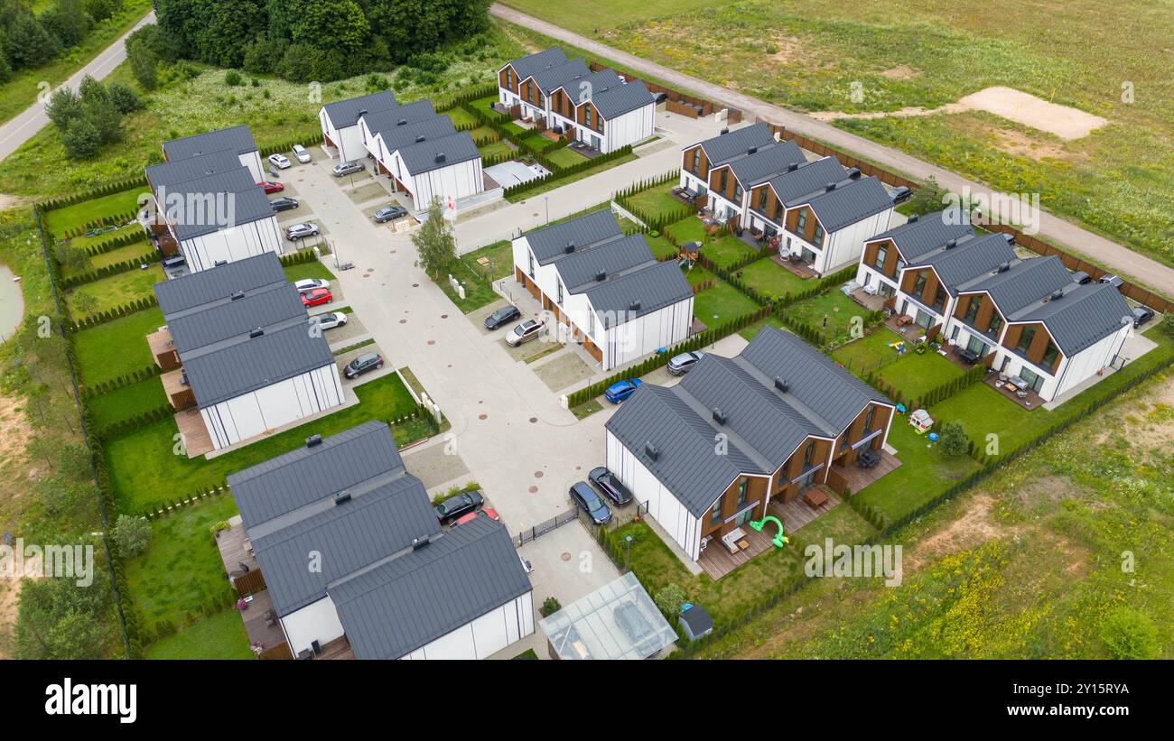 Aerial view of a residential area with modern houses surrounded by ...