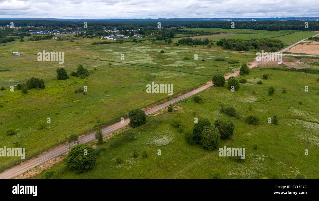 Aerial view of a residential area with modern houses surrounded by ...