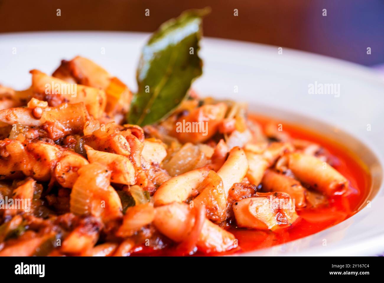 typical Majorcan octopus with onion. Villafranca de Bonany. Mallorca. Balearic Islands. Spain. Stock Photo