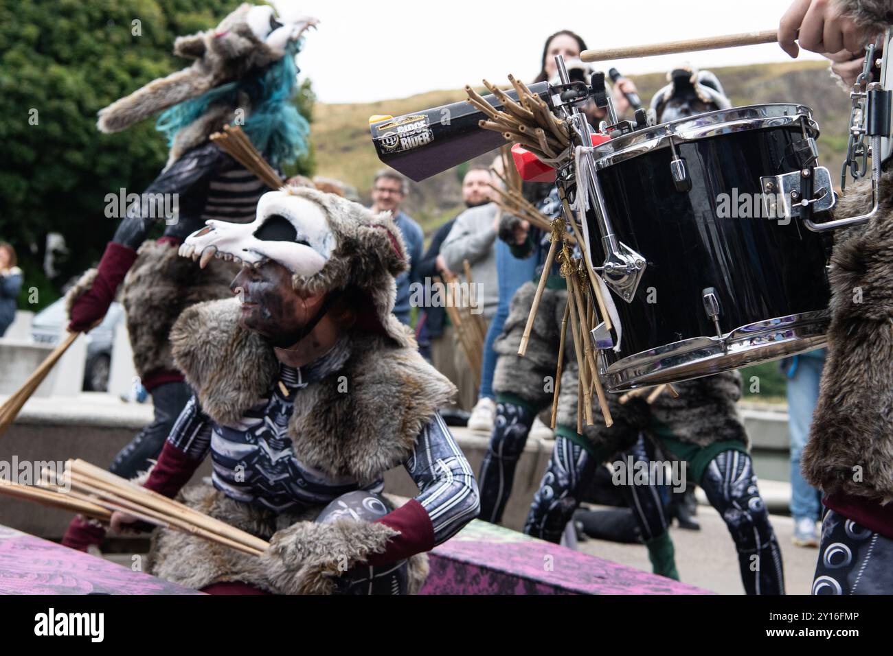 Surge Scotland performing a funereal excerpt from their large-scale street spectacle and musical pandemonium show 'Beautiful Bones', as part of a protest outside Scottish Parliament on 5 September 2024 in response to Creative Scotland announcing its decision on 19 August to abolish its fund for individual arts professionals due to funding constraints from the Scottish government; an announcement was made late on 4 September that the fund would be reinstated, however there are ongoing concerns about the future of arts funding in Scotland. This protest was organised by STUC (Scottish Trades Unio Stock Photo