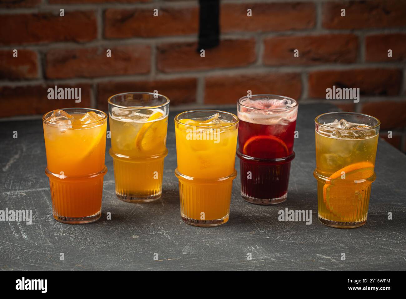 Glasses of assorted fruit lemonade beverages Stock Photo