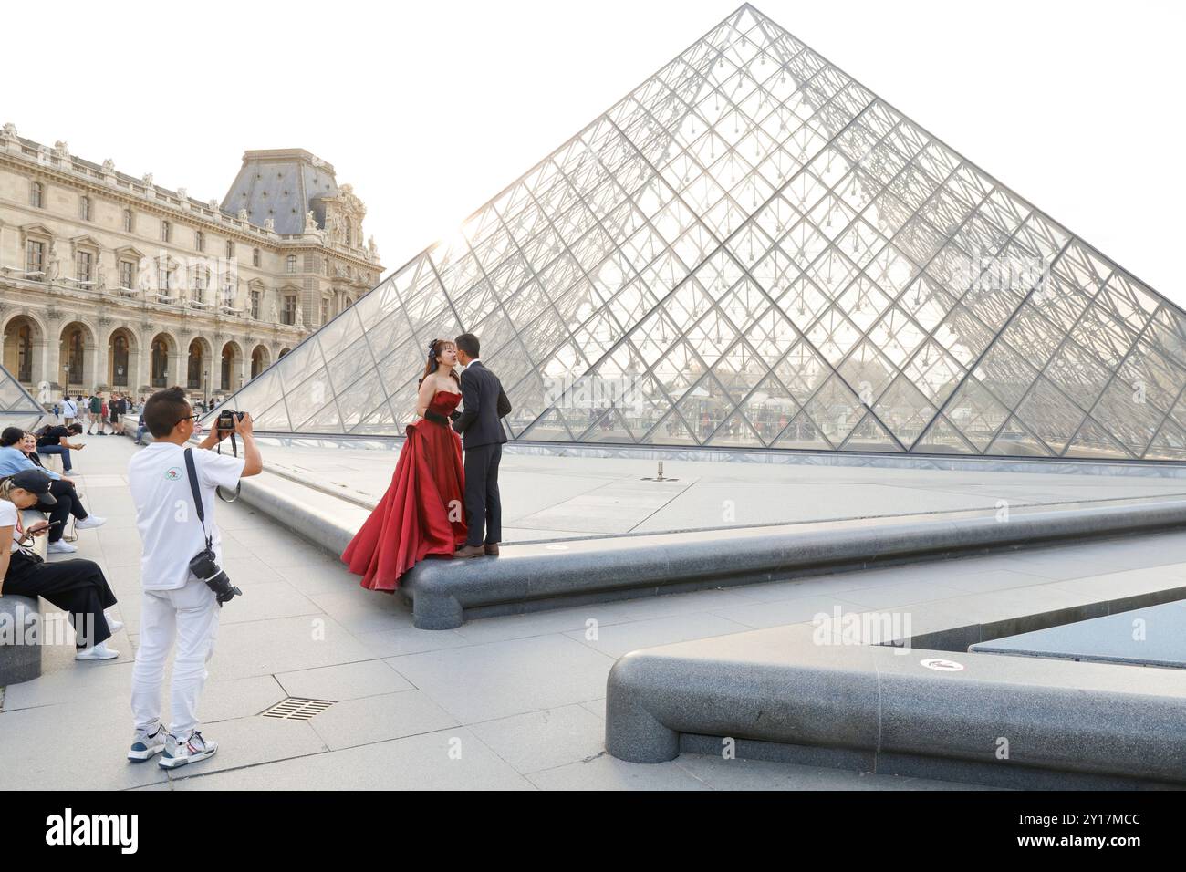 LOVE AT THE LOUVRE PYRAMID PARIS Stock Photo