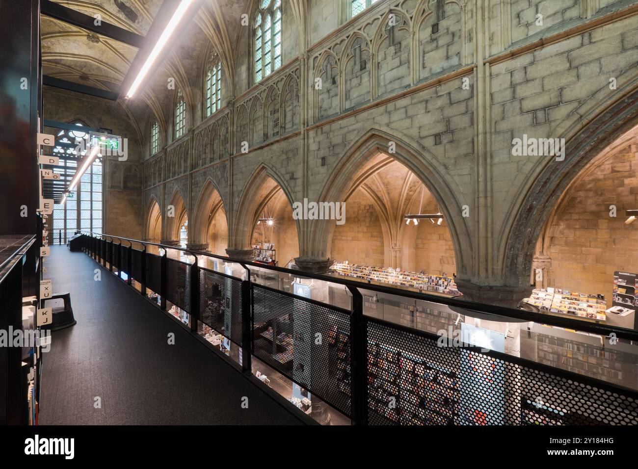 Interior of Dominican church converted into a bookstore. Cathedral ceilings and pillars of the church in Maastricht Stock Photo