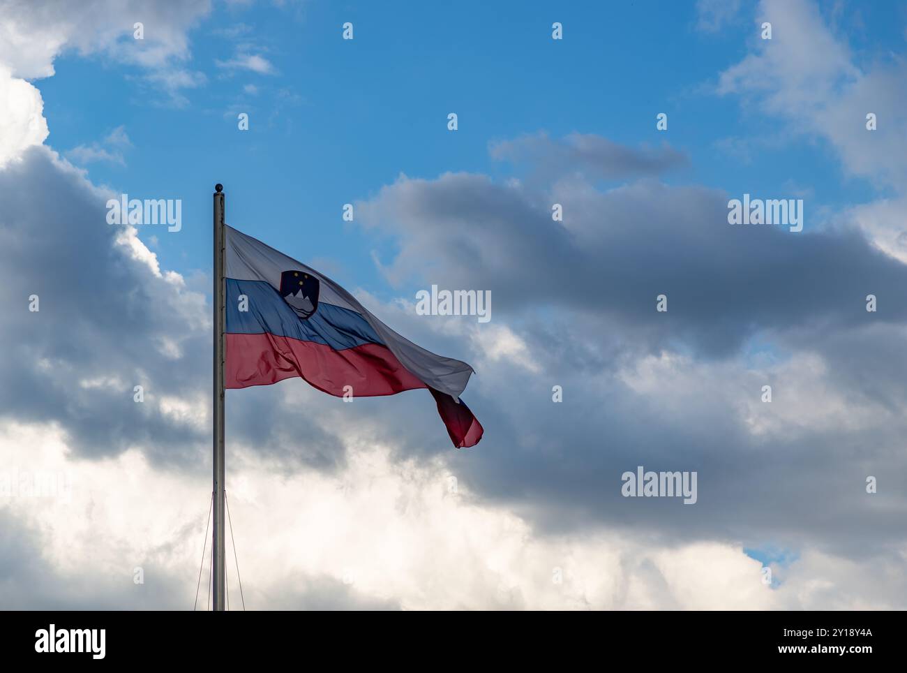 A picture of a Slovenian flag waving in the air. Stock Photo