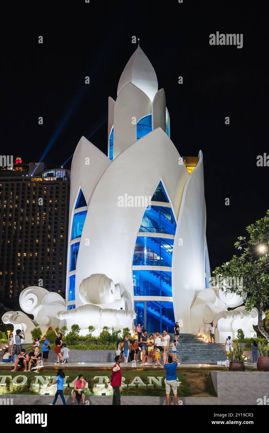 Lotus Tower Thap Tram Huong in the center of Nha Trang city on the waterfront at night. Nha Trang, Vietnam - July 17, 2024 Stock Photo