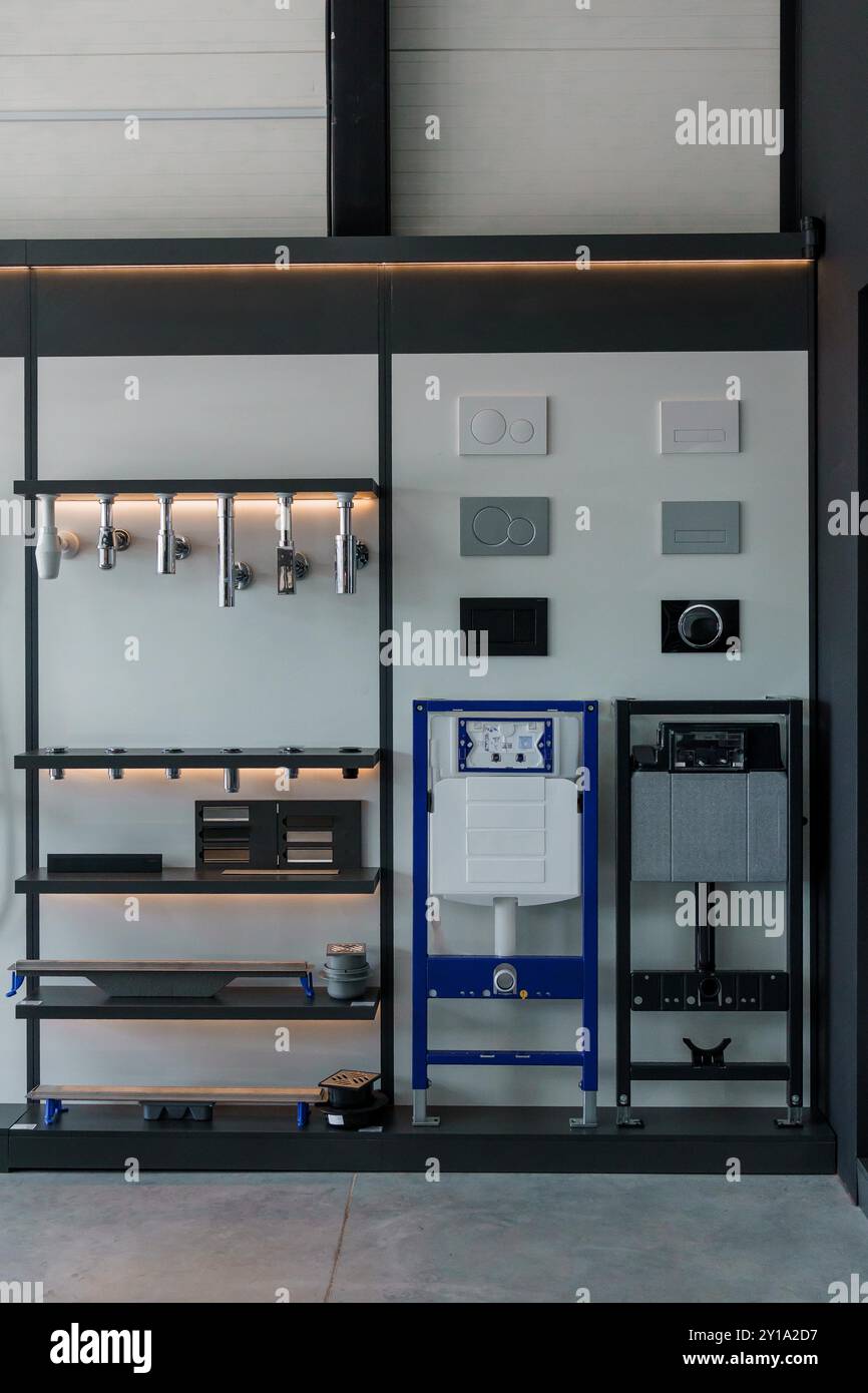 Stylish Industrial Display of Plumbing Fixtures and Modern Wall Plates ...