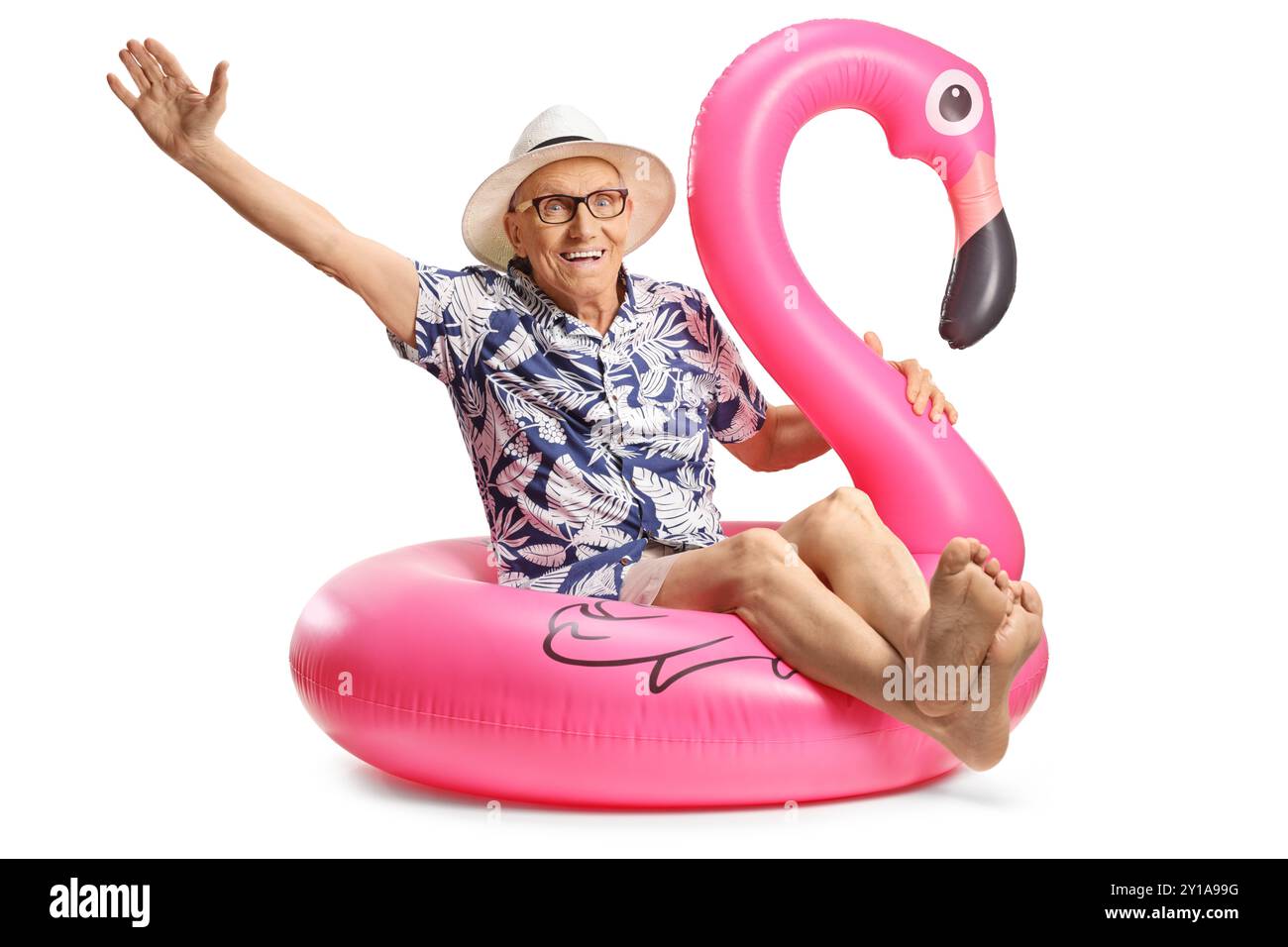 Elderly man sitting on a big inflatable flamingo rubber ring isolated ...