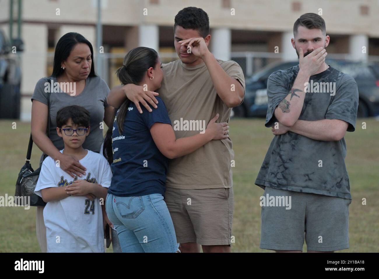 Winder, Georgia, USA. 5th Sep, 2024. People gather Thursday evening to lay flowers and pray in front of the growing memorial at Apalachee High School, September 5th 2024. (Credit Image: © Christopher Oquendo/ZUMA Press Wire) EDITORIAL USAGE ONLY! Not for Commercial USAGE! Stock Photo