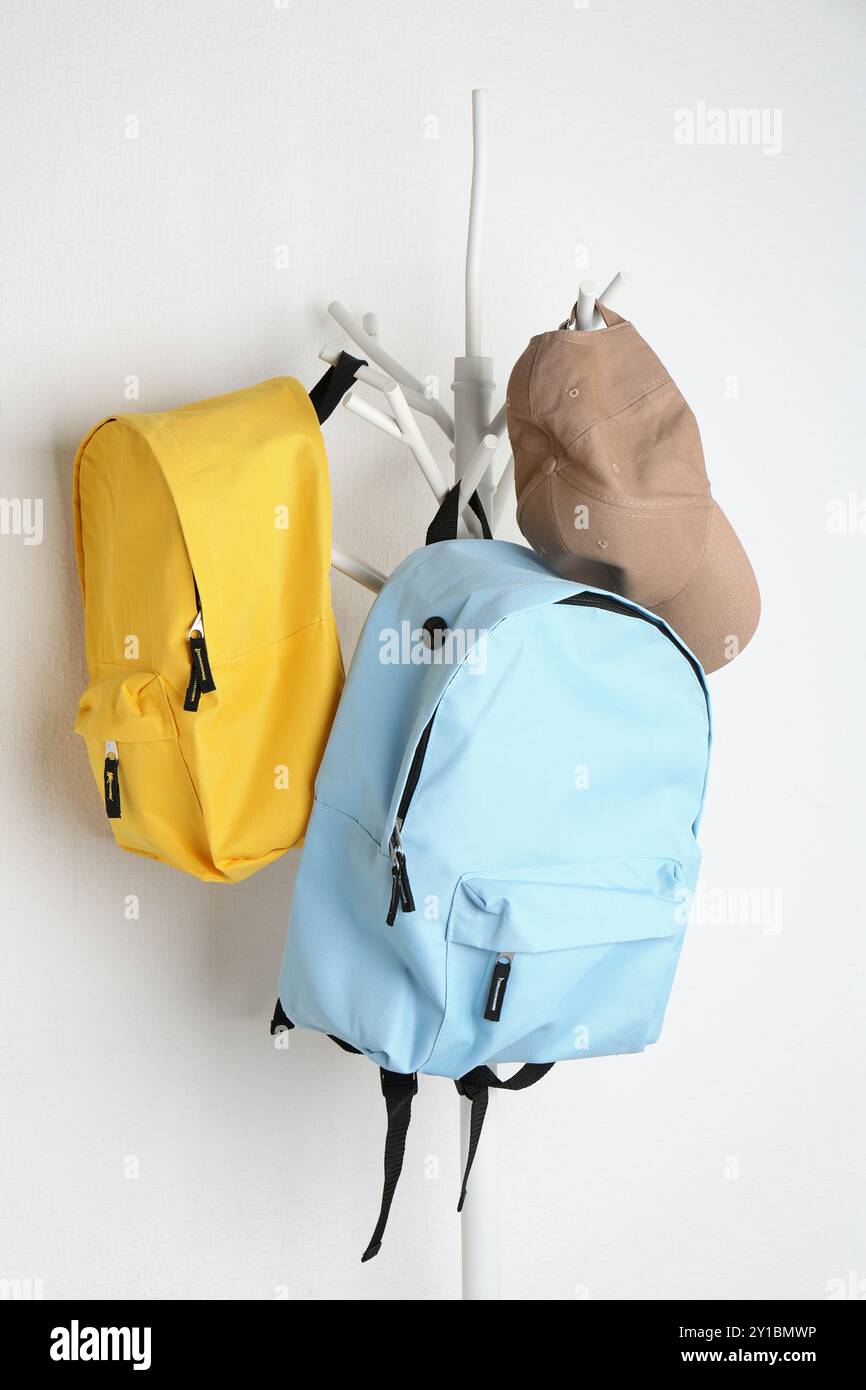 Backpacks hanging on wall hi res stock photography and images Alamy