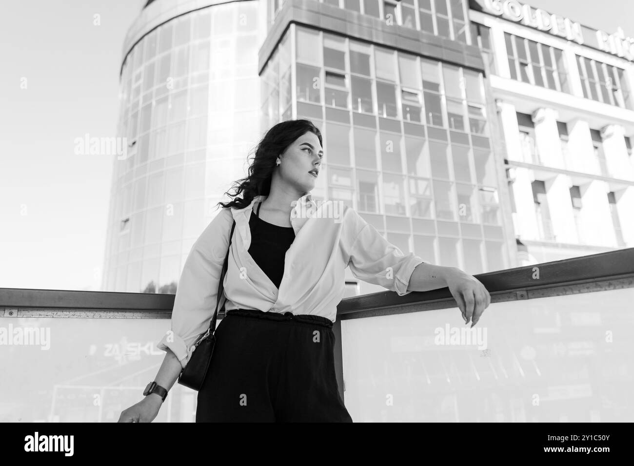 Urban Elegance: Confident Woman Posing in Modern Cityscape Stock Photo ...